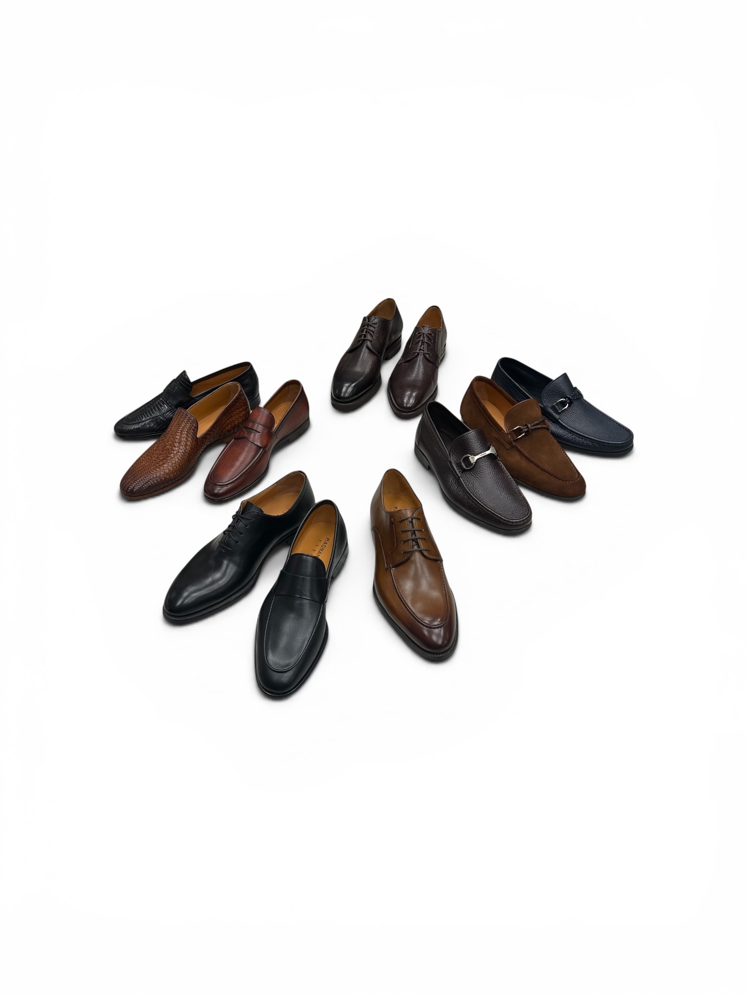A variety of men's dress shoes arranged on a white background,