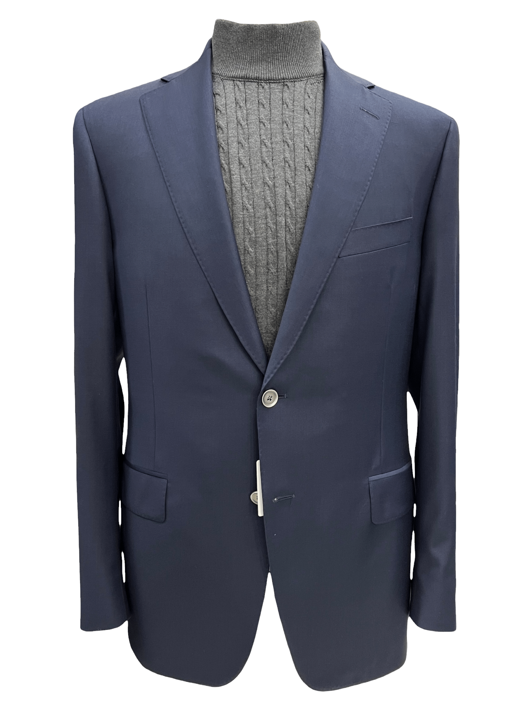 Navy blazer paired with a gray cable-knit turtleneck