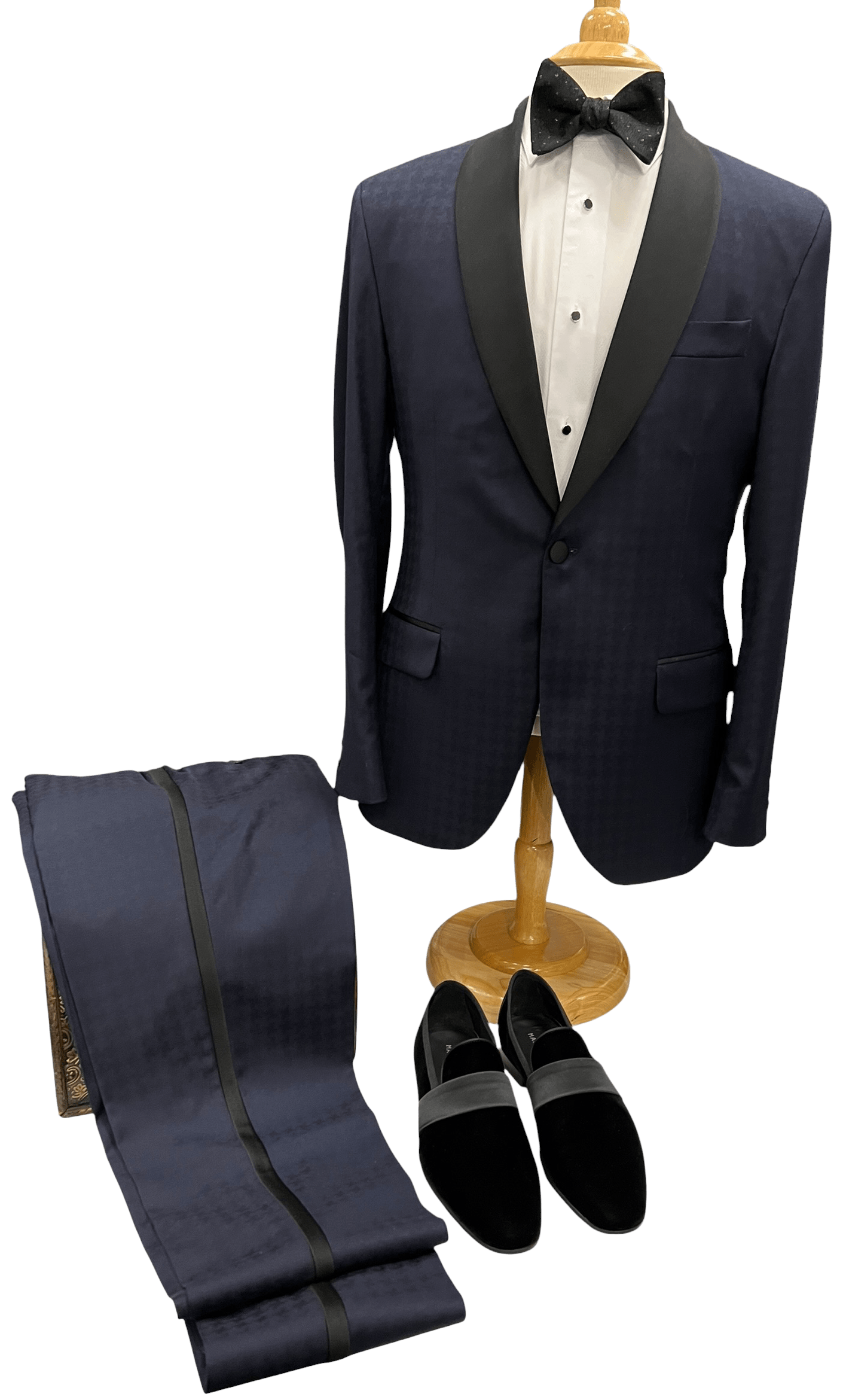 : Navy tuxedo with black satin lapels, paired with matching pants and stylish black loafers