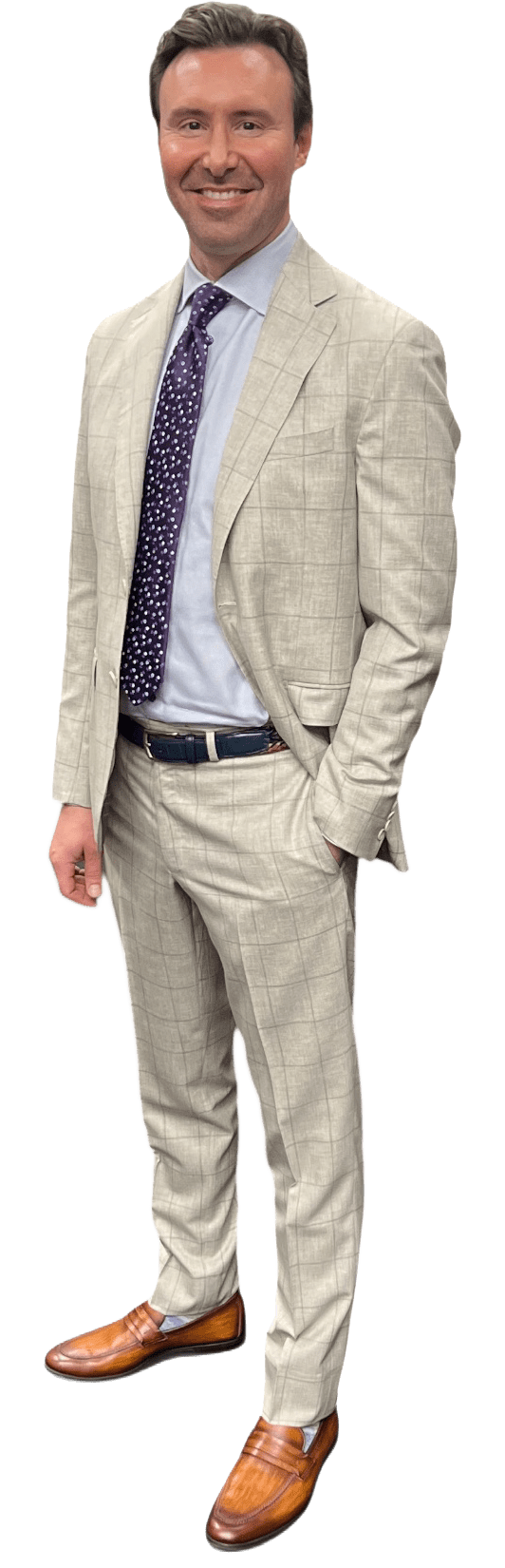 Man in a light gray plaid suit and brown loafers