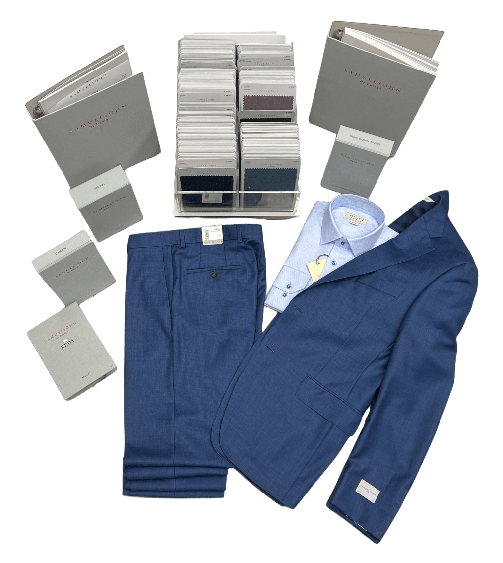 A stylish blue suit jacket and pants lay atop fabric swatch books from Samuelsohn,
